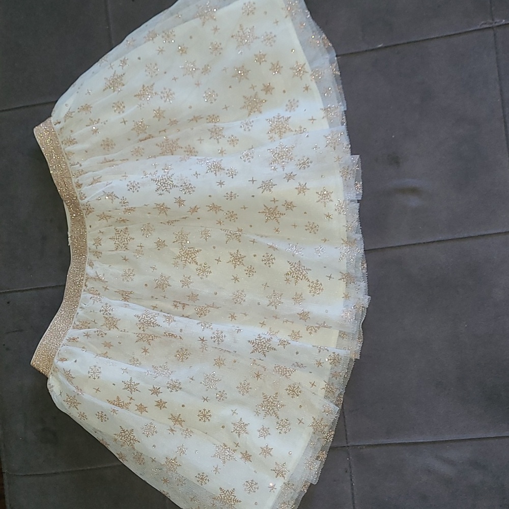 Girls tutu skirt/ size(7-8) US/ snow flakes color cream & Gold.